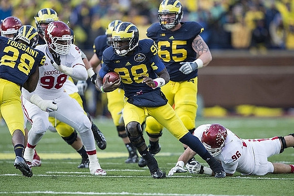 Fitzgerald Toussaint (28), Devin Gardner (98), and Kyle Bosch (65)