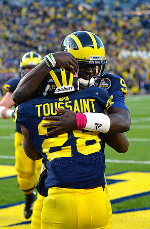 Fitzgerald Toussaint (28), Devin Gardner (98), and Kyle Bosch (65)