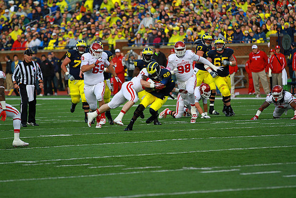 Erik Magnuson (78), Graham Glasgow (61), Fitzgerald Toussaint (28), Devin Gardner (98), Taylor Lewan (77), and Kyle Bosch (65)