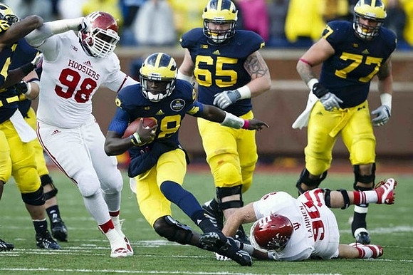 Fitzgerald Toussaint (28), Kyle Bosch (65), and Taylor Lewan (77)