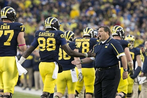 Taylor Lewan (77), Devin Gardner (98), Joe Kerridge (36), Erik Magnuson (78), and Brady Hoke