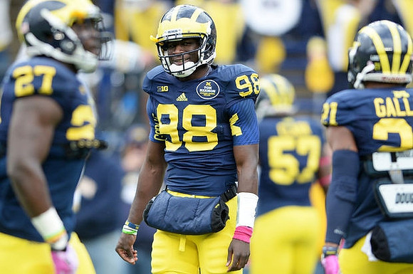 Derrick Green (27), Devin Gardner (98), and Jeremy Gallon (21)