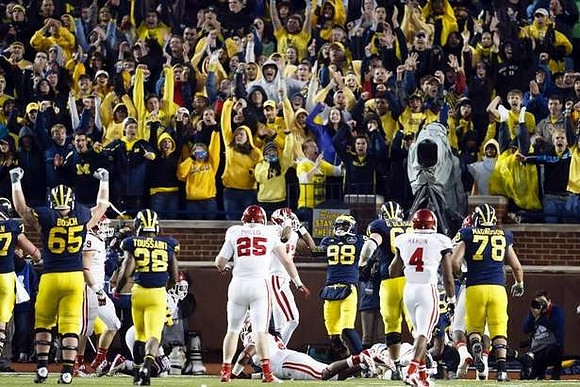 Kyle Bosch (65), Fitzgerald Toussaint (28), Devin Gardner (98), Graham Glasgow (61), and Erik Magnuson (78)