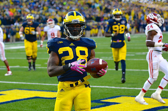 Fitzgerald Toussaint (28), Devin Gardner (98), and Kyle Bosch (65)