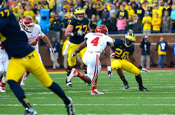 Jeremy Jackson (17), Taylor Lewan (77),  and Fitzgerald Toussaint (28)