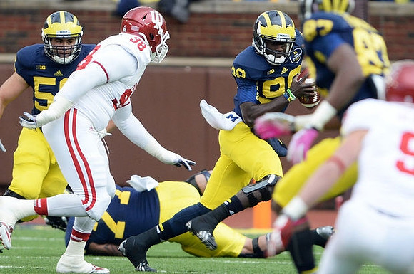 Joey Burzynski (56), Taylor Lewan (77), Devin Gardner (98), and Devin Funchess (87)