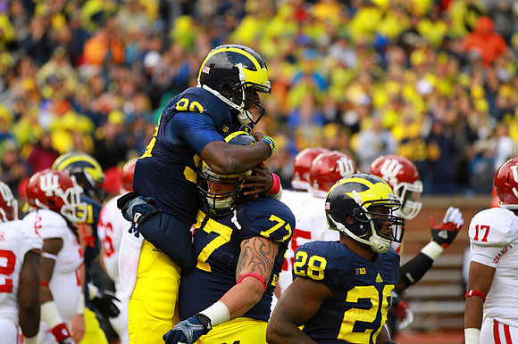Devin Gardner (98), Taylor Lewan (77), and Fitzgerald Toussaint (28)