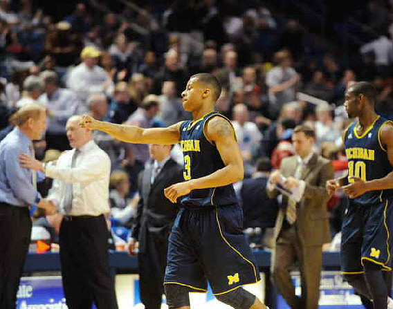 John Beilein, Patrick Chambers, Trey Burke (3), and Tim Hardaway Jr. (10)