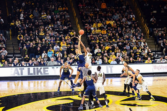 Zak Irvin (21), D.J. Wilson (5), Derrick Walton Jr. (10), and Moritz Wagner (13)