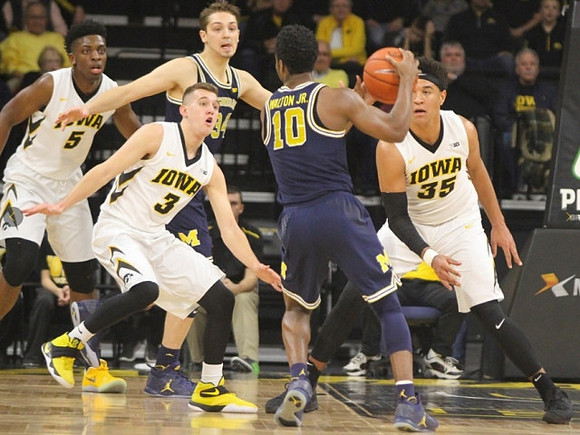Derrick Walton Jr. (10) and Mark Donnal (34)