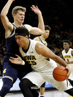 Moritz Wagner (13) and D.J. Wilson (5)