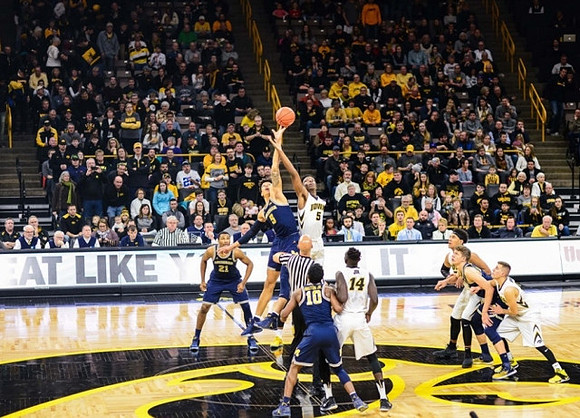 D.J. Wilson (5), Zak Irvin (21), Derrick Walton Jr. (10), and Moritz Wagner (13)