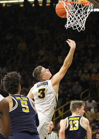 D.J. Wilson (5) and Moritz Wagner (13)