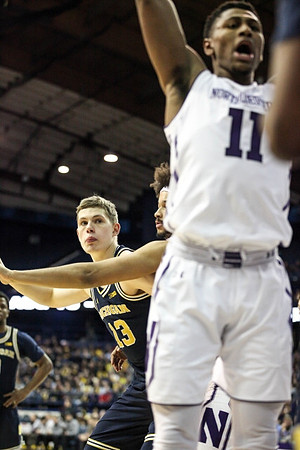 Moritz Wagner (13) and Zavier Simpson (3)