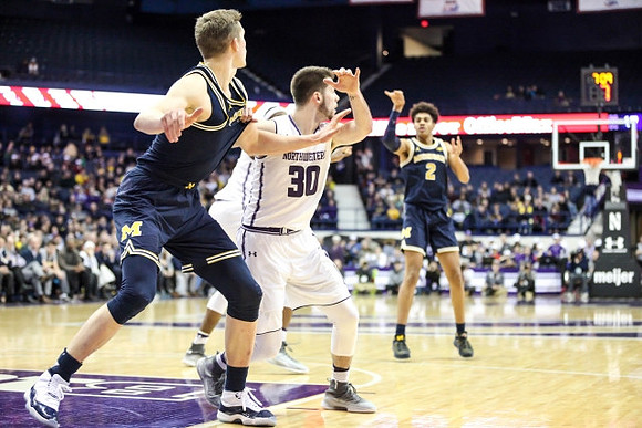 Moritz Wagner (13) and Jordan Poole (2)