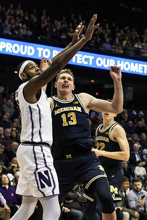 Moritz Wagner (13) and Duncan Robinson (22)