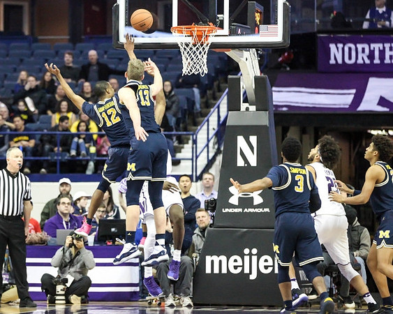 Muhammad-Ali Abdur-Rahkman (12), Moritz Wagner (13), Zavier Simpson (3), and Jordan Poole (2)