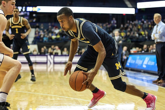 Muhammad-Ali Abdur-Rahkman (12), Charles Matthews (1), and John Beilein