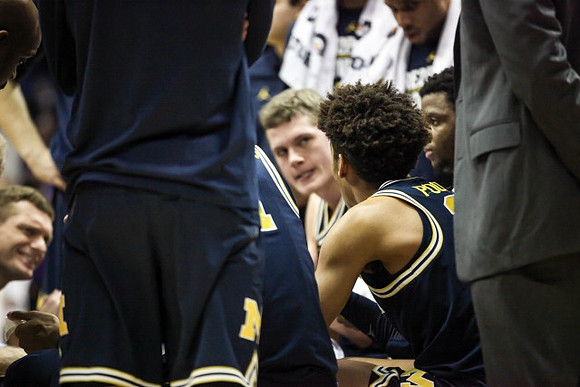 Moritz Wagner (13), Jordan Poole (2), and Zavier Simpson (3)