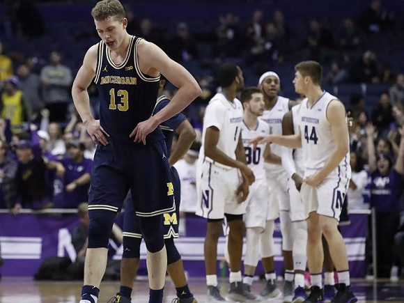 Moritz Wagner (13) and Zavier Simpson (3)