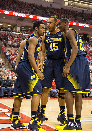 Derrick Walton Jr. (10), Jon Horford (15), and Caris LeVert (23)