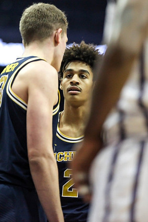 Moritz Wagner (13) and Jordan Poole (2)