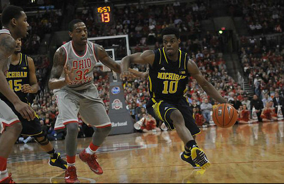 Jon Horford (15) and Derrick Walton Jr. (10)