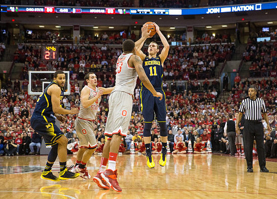 Jordan Morgan (52) and Nik Stauskas (11)