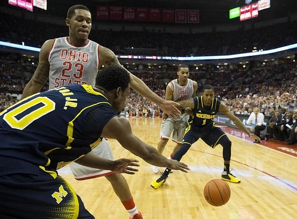 Derrick Walton Jr. (10) and Glenn Robinson III (1)