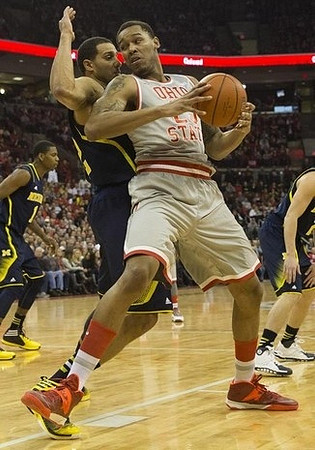 Glenn Robinson III (1) and Jordan Morgan (52)