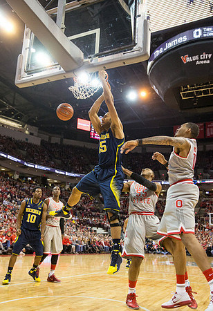 Derrick Walton Jr. (10) and Jon Horford (15)