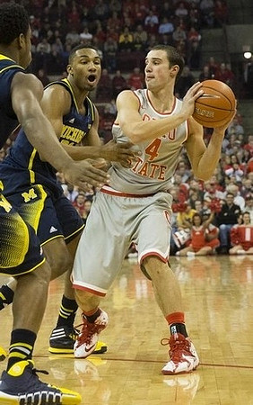 Derrick Walton Jr. (10) and Zak Irvin (21)