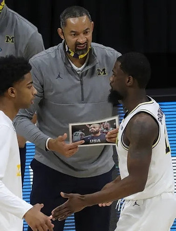 C.J. Baird (24), Juwan Howard, and Chaundee Brown Jr. (15)