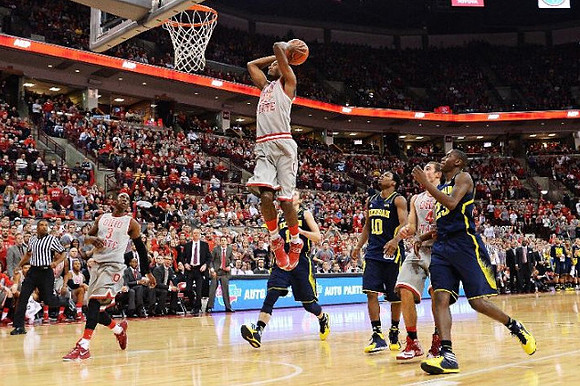 Nik Stauskas (11), Derrick Walton Jr. (10), and Caris LeVert (23)