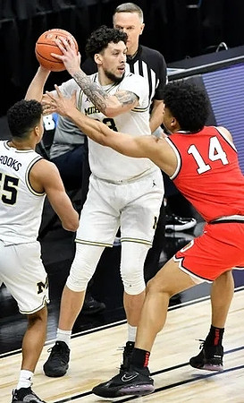 Eli Brooks (55) and Brandon Johns Jr. (23)