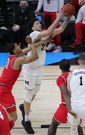 Brandon Johns Jr. (23) and Hunter Dickinson (1)
