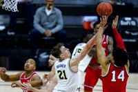 Hunter Dickinson (1), Franz Wagner (21), and Chaundee Brown Jr. (15)