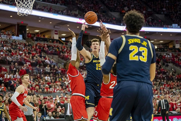 Jon Teske (15), Brandon Johns Jr. (23), and Juwan Howard