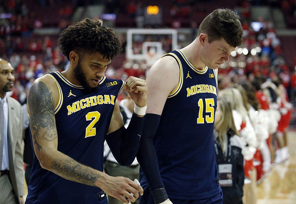 Saddi Washington, Isaiah Livers (2), and Jon Teske (15)