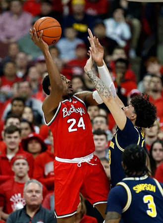 Zavier Simpson (3) and Brandon Johns Jr. (23)