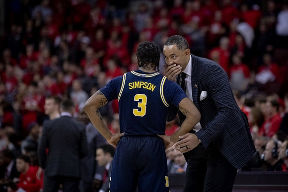 Zavier Simpson (3) and Juwan Howard