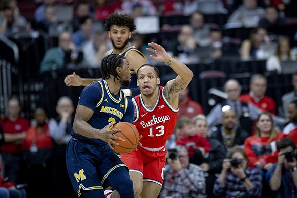 Zavier Simpson (3) and Isaiah Livers (2)