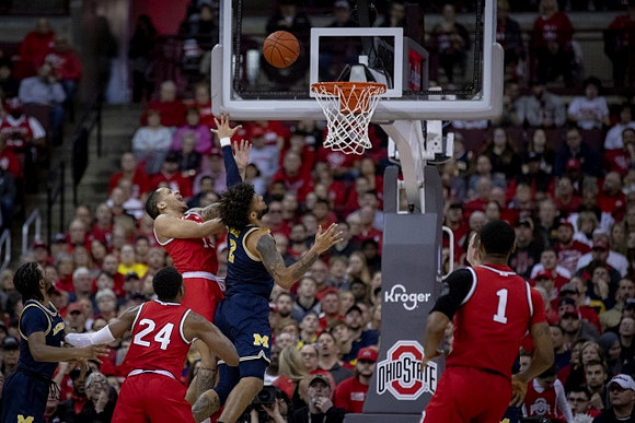 Zavier Simpson (3), Isaiah Livers (2), and Jon Teske (15)
