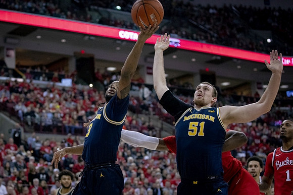 Zavier Simpson (3), Austin Davis (51), and Isaiah Livers (2)