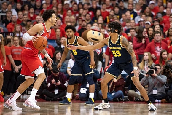 David DeJulius (0) and Eli Brooks (55)