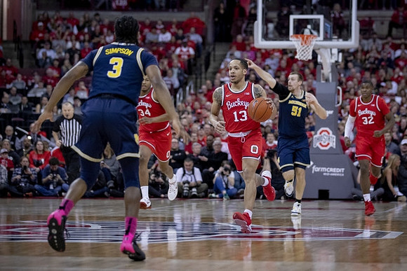 Zavier Simpson (3) and Austin Davis (51)