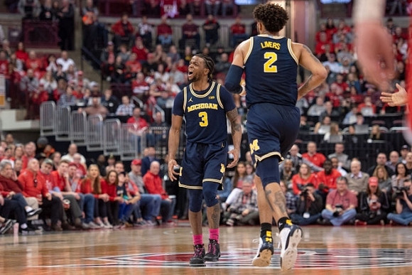 Zavier Simpson (3) and Isaiah Livers (2)