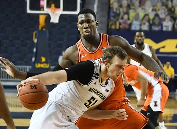 Austin Davis (51) and Chaundee Brown Jr. (15)