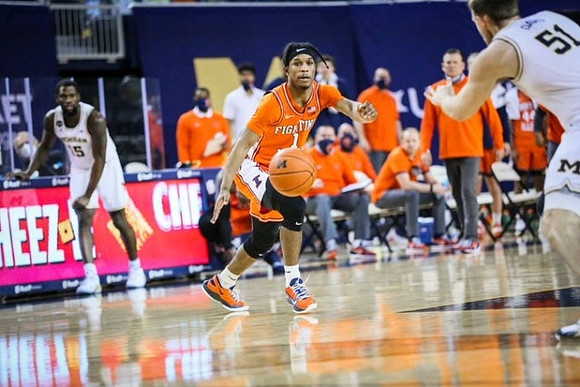 Chaundee Brown Jr. (15) and Austin Davis (51)