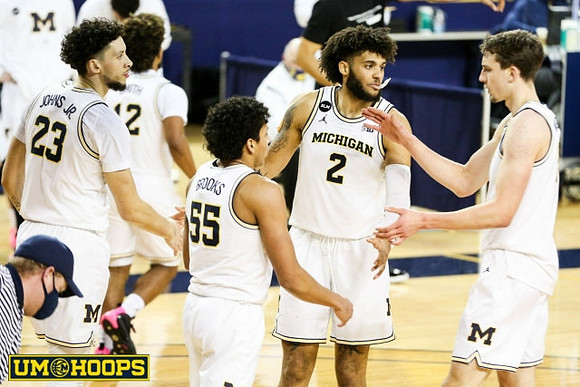 Franz Wagner (21), Mike Smith (12), Eli Brooks (55), Isaiah Livers (2), and Franz Wagner (21)